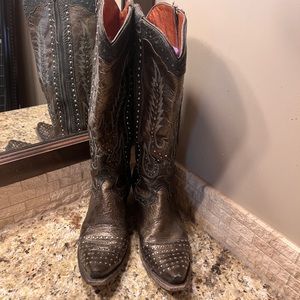 Women's Dan Post black and steel colored dress boots.